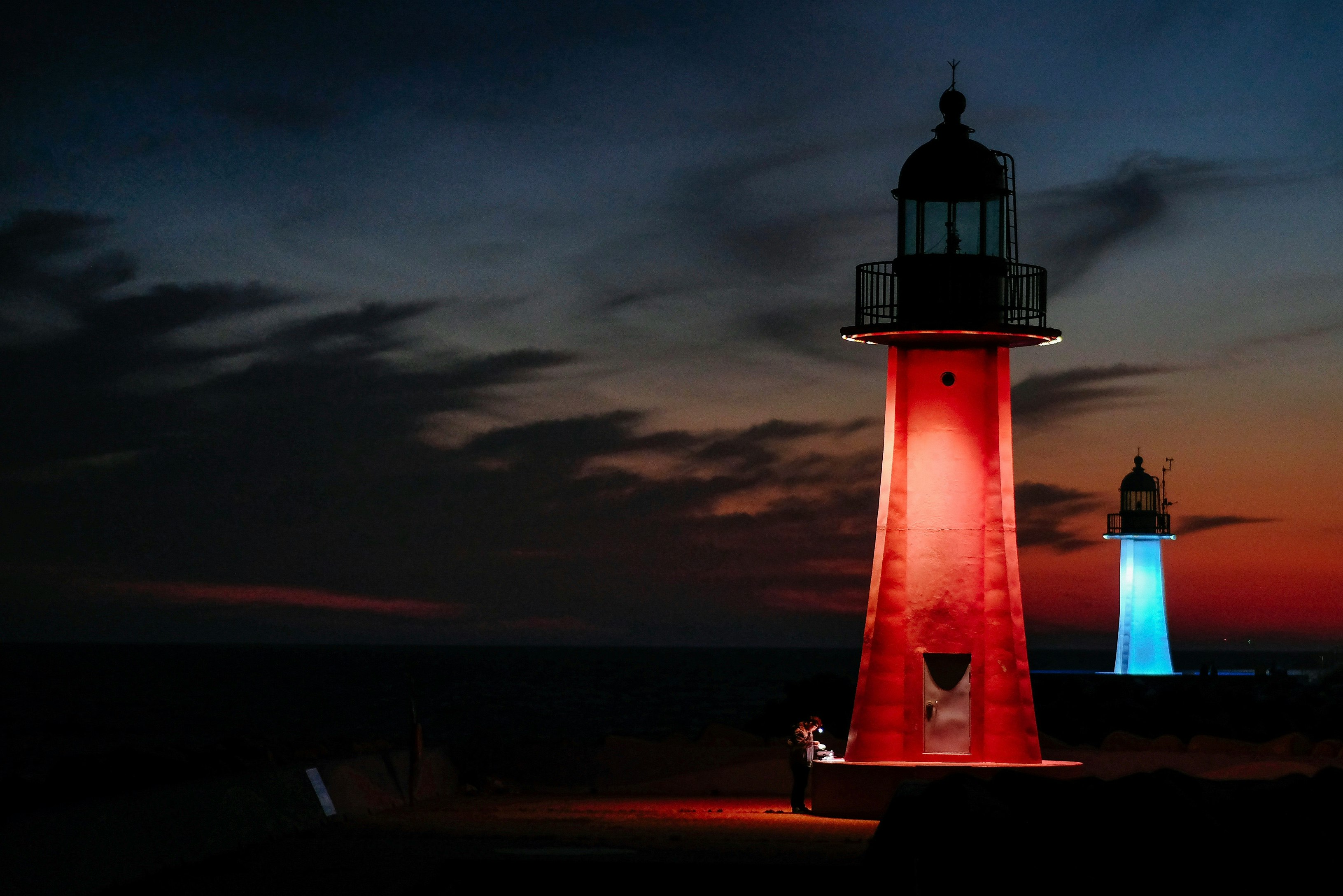 red and blue lighter watch towers during nighttime